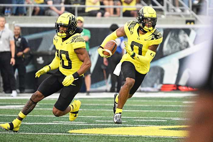 Oregon Ducks cornerback Christian Gonzalez returns an interception against the Eastern Washington Eagles at Autzen Stadium.